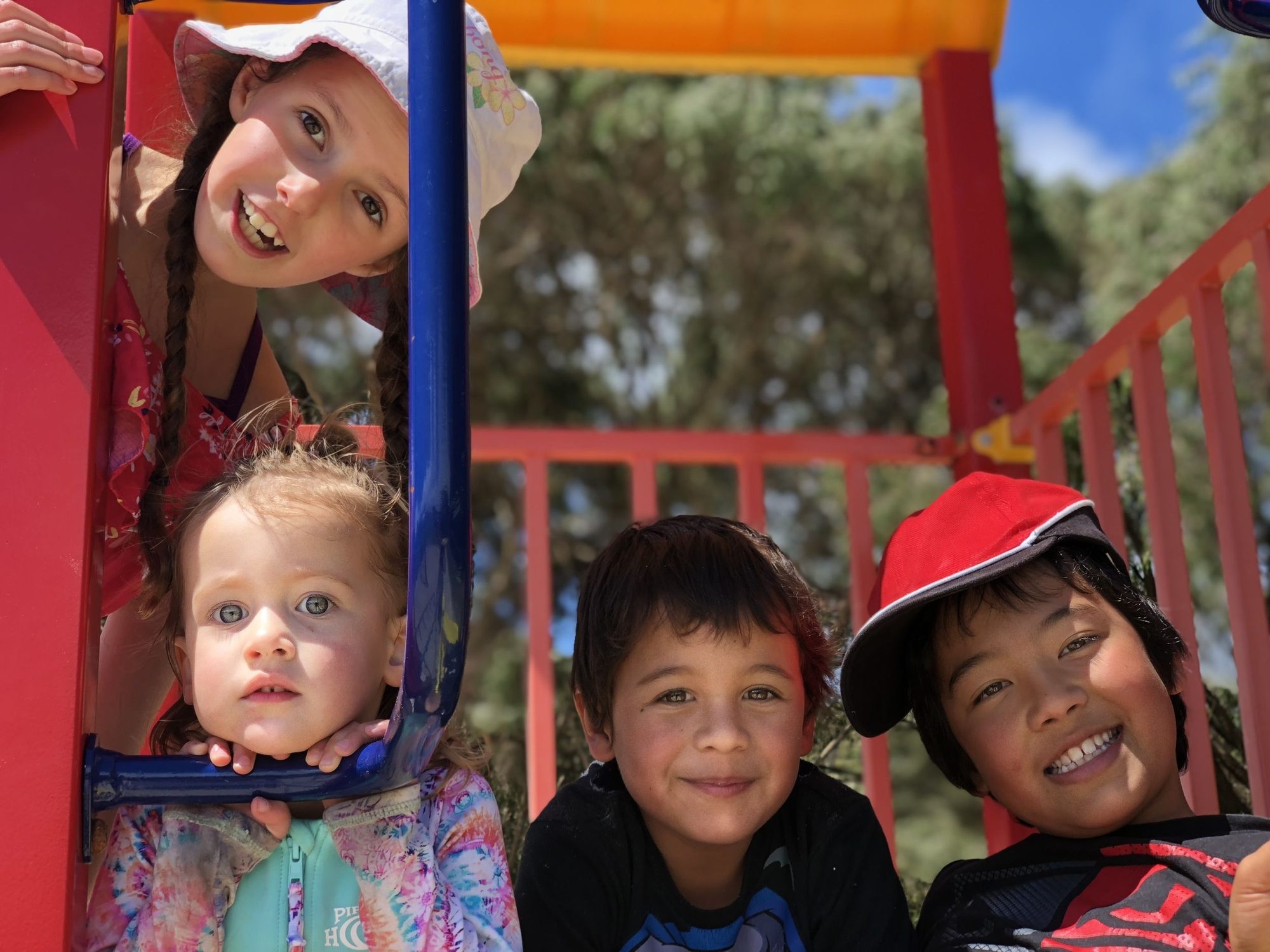 Kids smiling at the playground