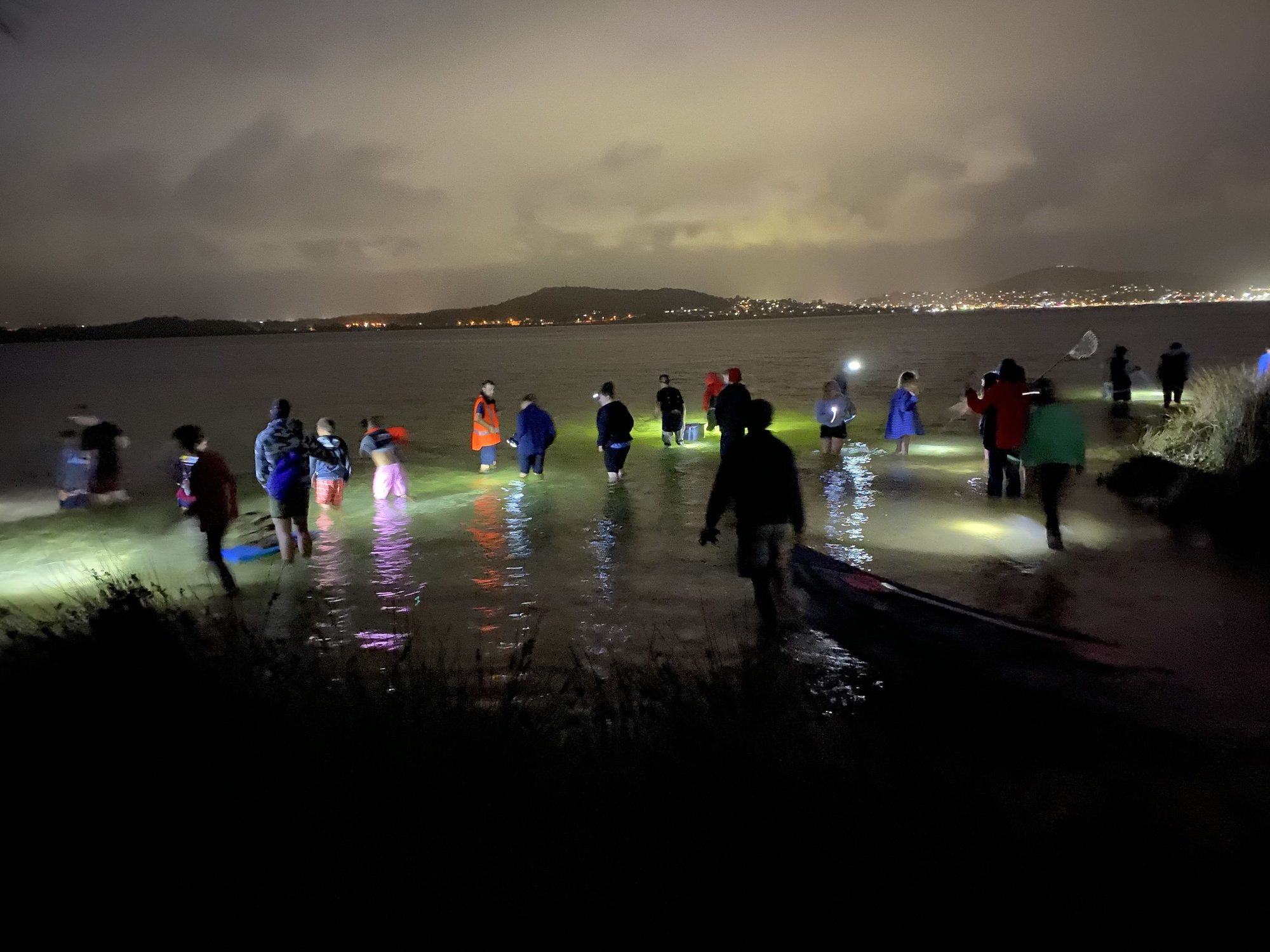 Youth at the beach at night